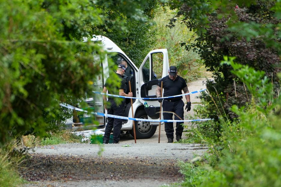 Police officers at a crime scene investigation.