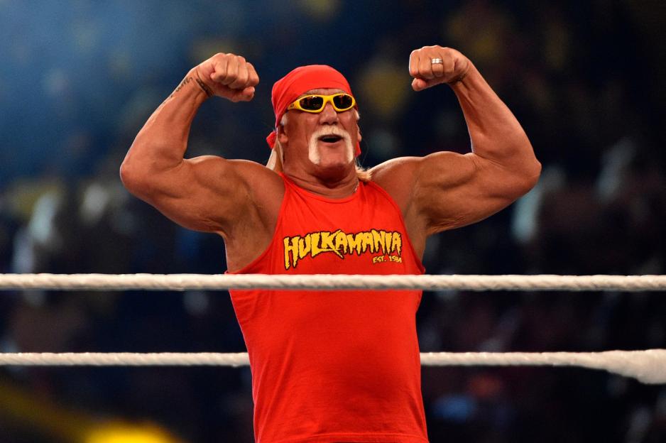 Hulk Hogan flexing in a wrestling ring.