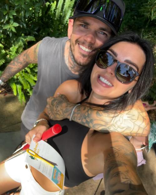 Couple embracing outdoors.