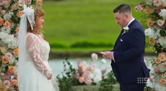 A groom looking unhappy at his wedding ceremony.