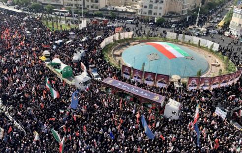 Large crowd of mourners in a public square.