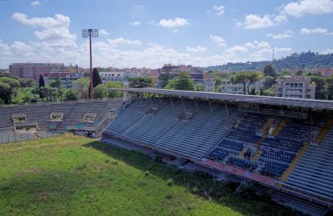 Aerial view of Flaminio Stadium in Rome, overgrown and vandalized.