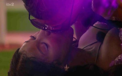 Two people kissing.