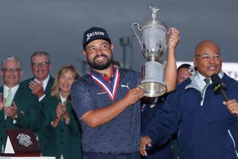 J.J. Spaun holding the U.S. Open trophy.