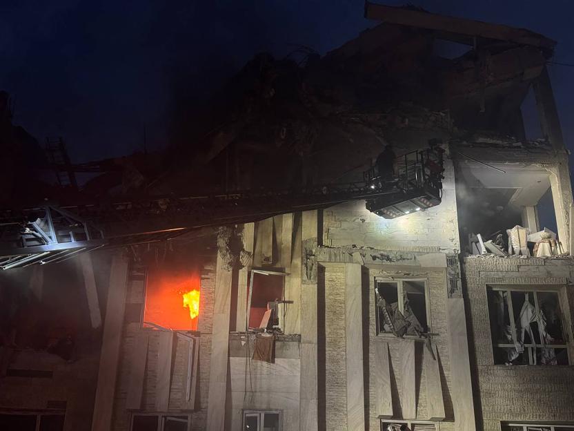 Damage to buildings and cars following an Israeli attack in Tehran.
