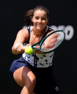 Jodie Burrage playing tennis.
