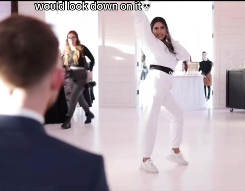 Bride dancing at her wedding, knowing her religious family disapproves.