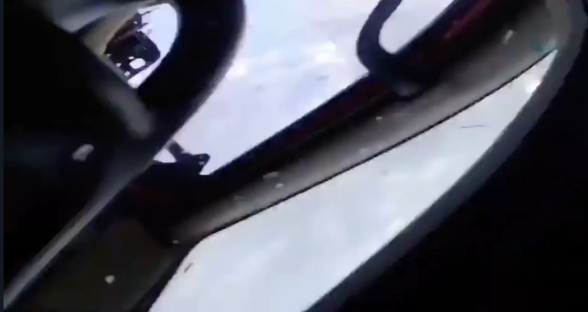 Screenshot of a vehicle's interior, showing the view from the driver's seat.