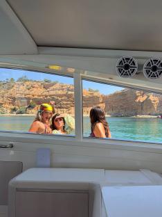 Three women on a boat in Ibiza.