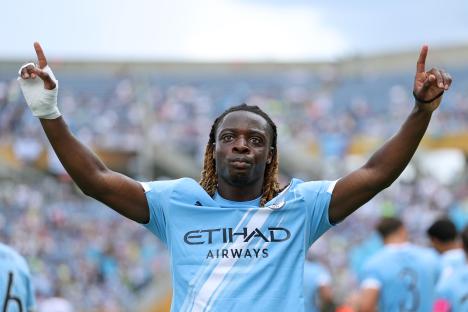 Jeremy Doku #11 of Manchester City celebrating a goal.