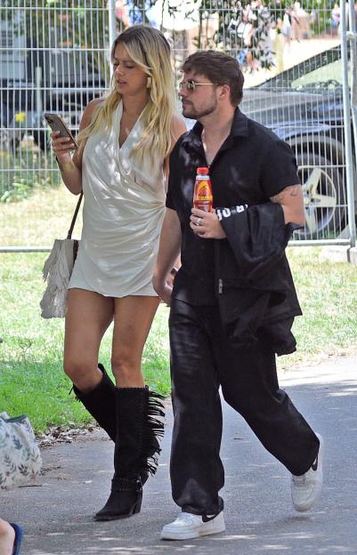 Tasha Ghouri and her boyfriend walking hand-in-hand.