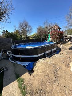 DIY 18ft pool installation in progress.