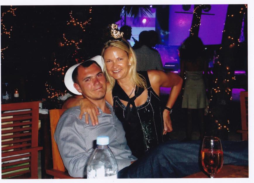 Photo of a woman and a man at a New Year's Eve party.