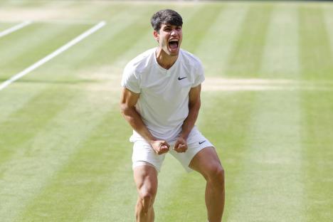 Tennis player celebrating a point on the court.