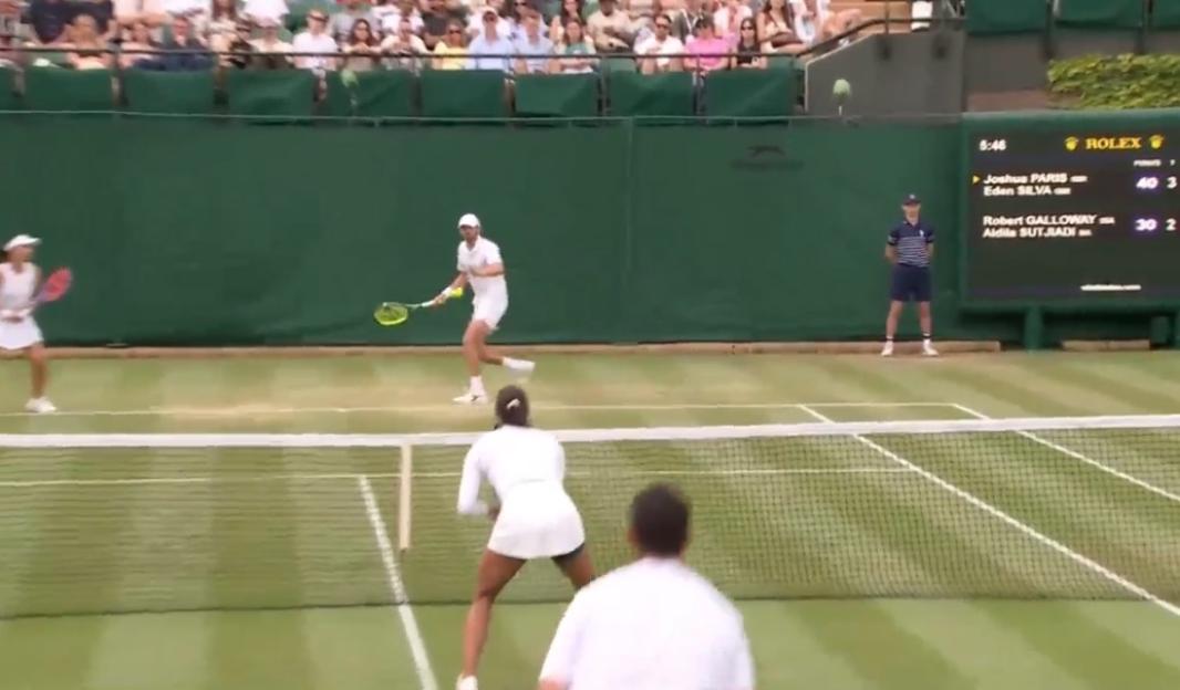 Tennis match in progress.