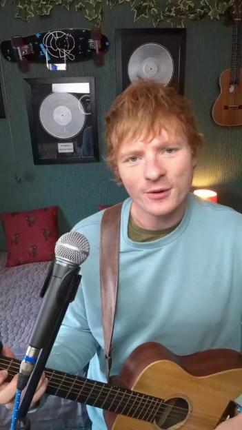 Ed Sheeran lookalike playing guitar.