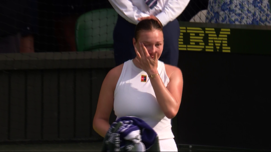 Tennis player crying after a match.