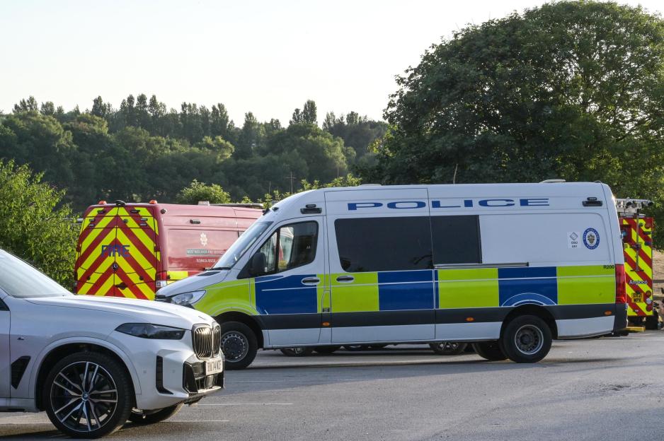 Police and fire vehicles at a scene.