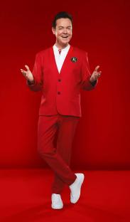 Stephen Mulhern in a red suit.