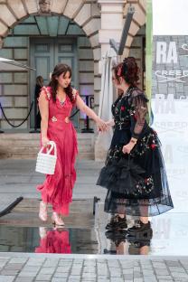 Two women in contrasting dresses at the Royal Academy of Arts Summer Exhibition Preview Party.