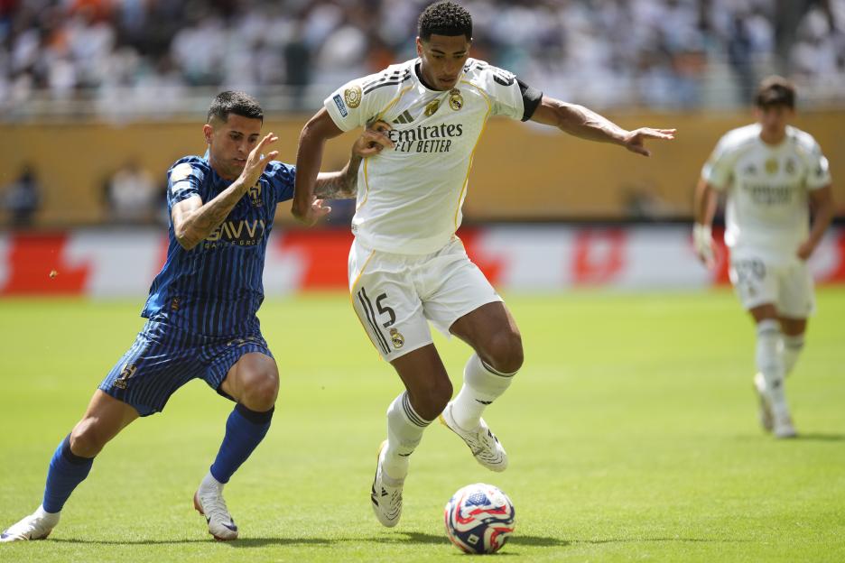 Jude Bellingham of Real Madrid vying for the ball during a soccer match.
