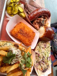 Tray of fried food, barbeque, and coleslaw.