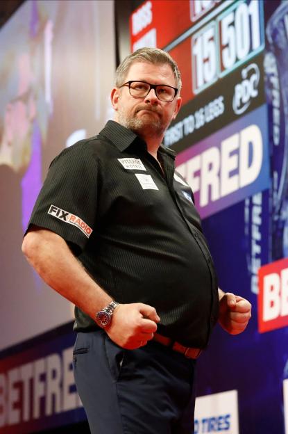 James Wade celebrating a darts match victory.