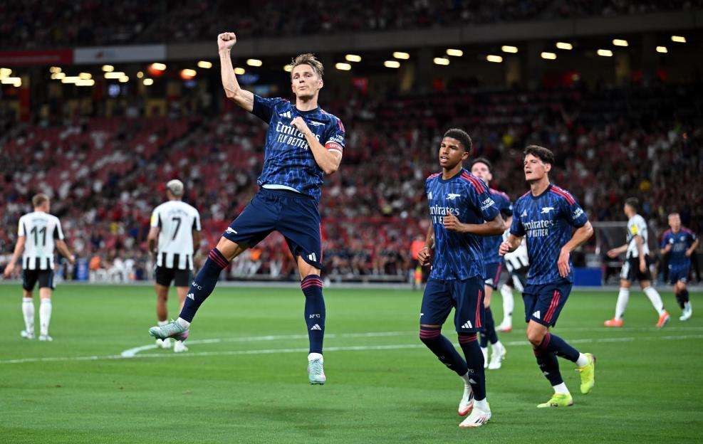Martin Ãdegaard of Arsenal celebrates scoring a goal.