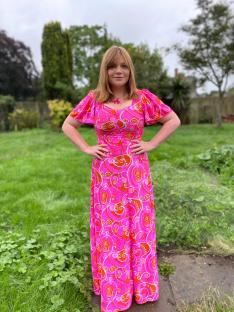 Reverend Kate Bottley in a pink vintage dress.