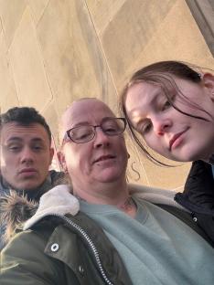 Selfie of a mother and her two children.