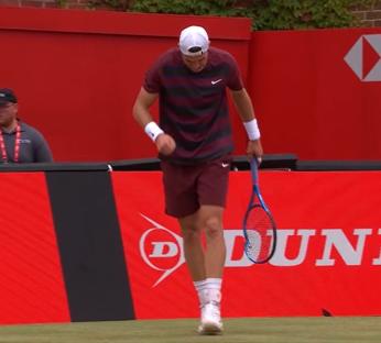 Tennis player walking off the court.