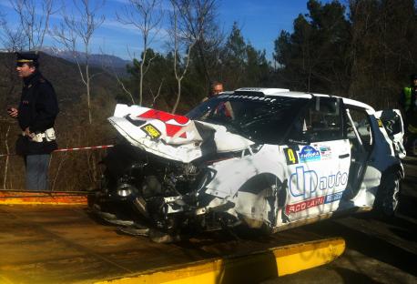 Wrecked race car on a tow truck.