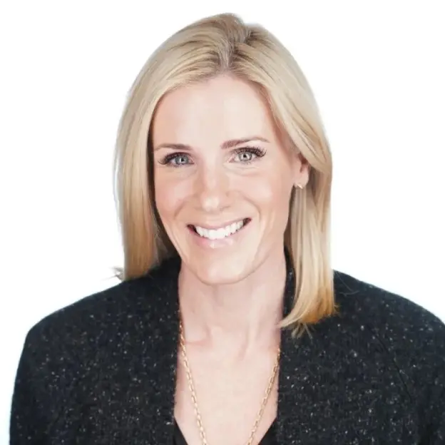 Headshot of a smiling woman with blonde hair.