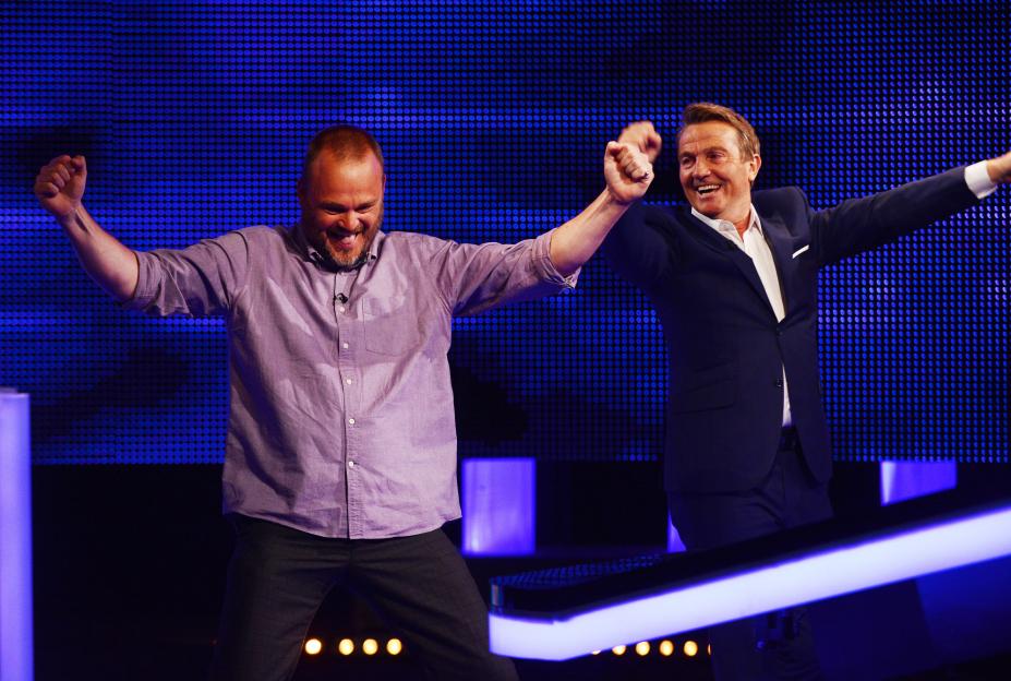 Paul Sinha and Bradley Walsh celebrating on The Chase.