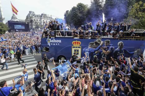 Real Oviedo players celebrate their promotion with fans.