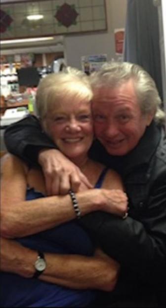 Photo of Peter Eric Greener and Sheila Jackson embracing.