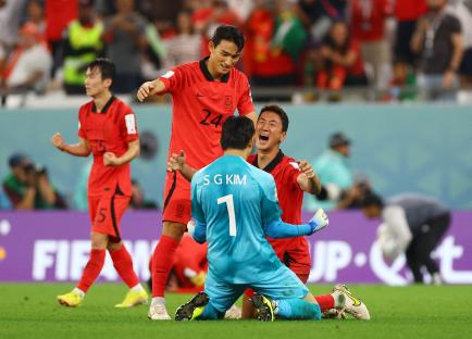 South Korean soccer players celebrating a victory.