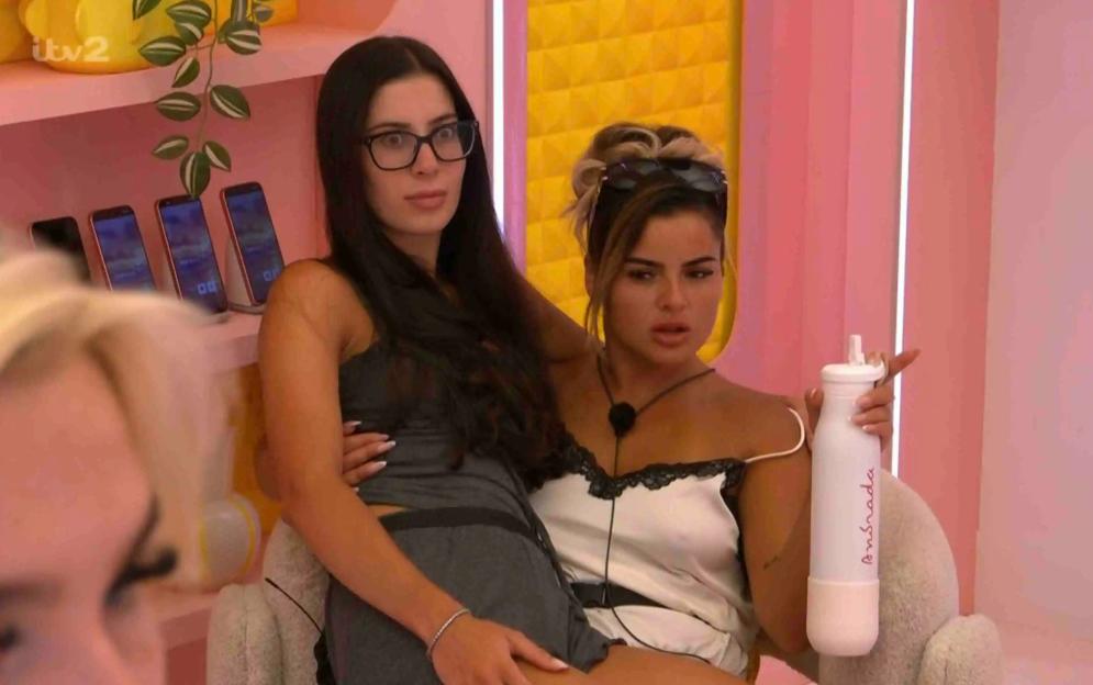 Three women chatting on a reality TV show.