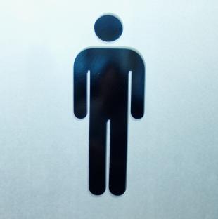Man entering a gym locker room.