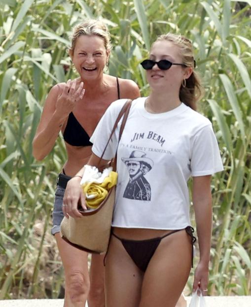 Kate Moss and her daughter Lila Moss laughing together on vacation in Ibiza.