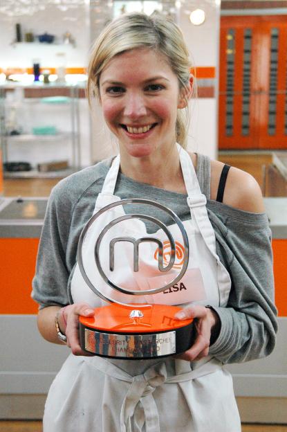 Lisa Faulkner holding the Celebrity MasterChef 2010 trophy.