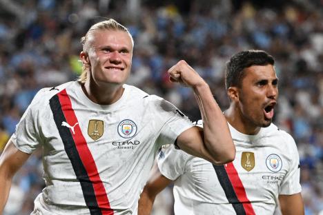 Erling Haaland and Rodri celebrating a goal.