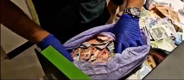 Seized cash in a plastic bag.