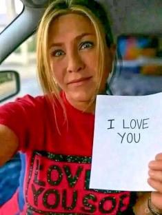 AI-generated image of Jennifer Aniston holding a sign that says 