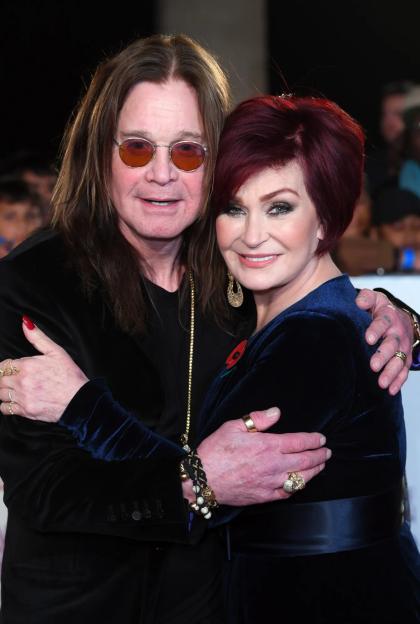 Ozzy Osbourne and Sharon Osbourne embracing.