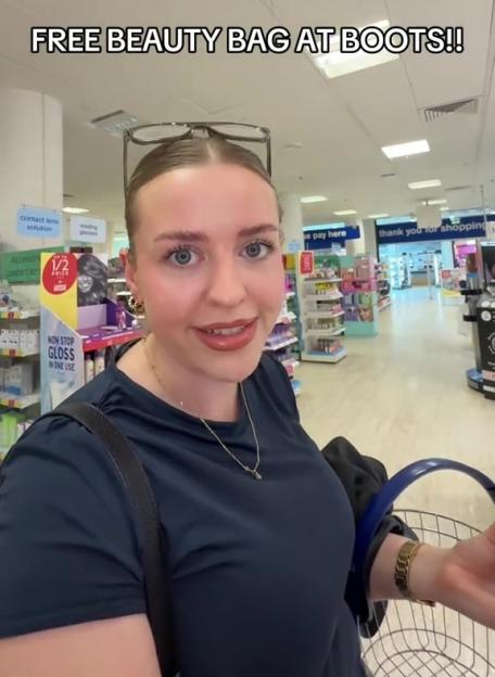 Woman in Boots store announces a free beauty bag.