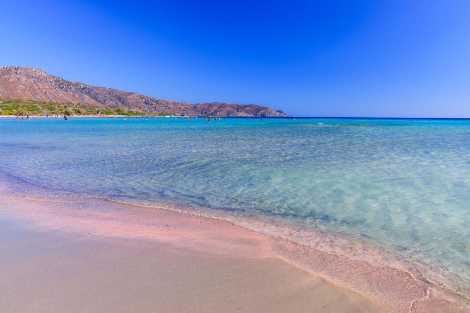 Pink sand beach with crystal clear water in Elafonissi, Crete, Greece.