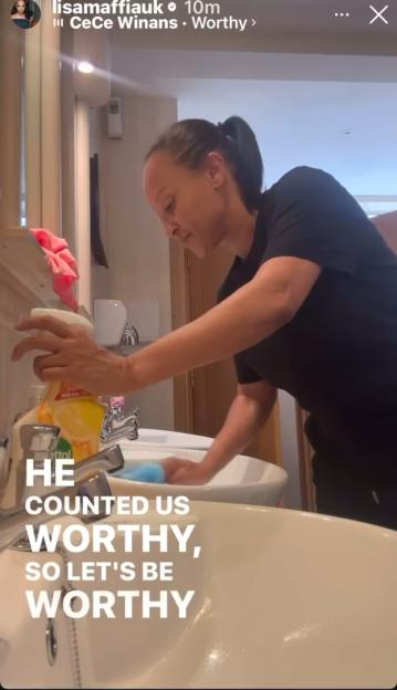 Lisa Maffia cleaning bathroom sinks.