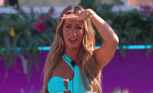 Meg from Love Island shielding her eyes.