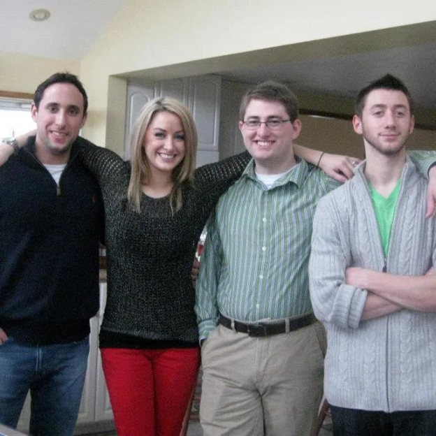 Four young adults posing for a photo.